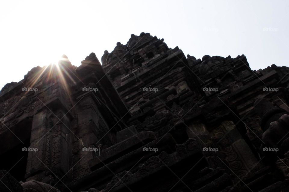 The morning sun shines on the corner of Prambanan temple, Central Java.