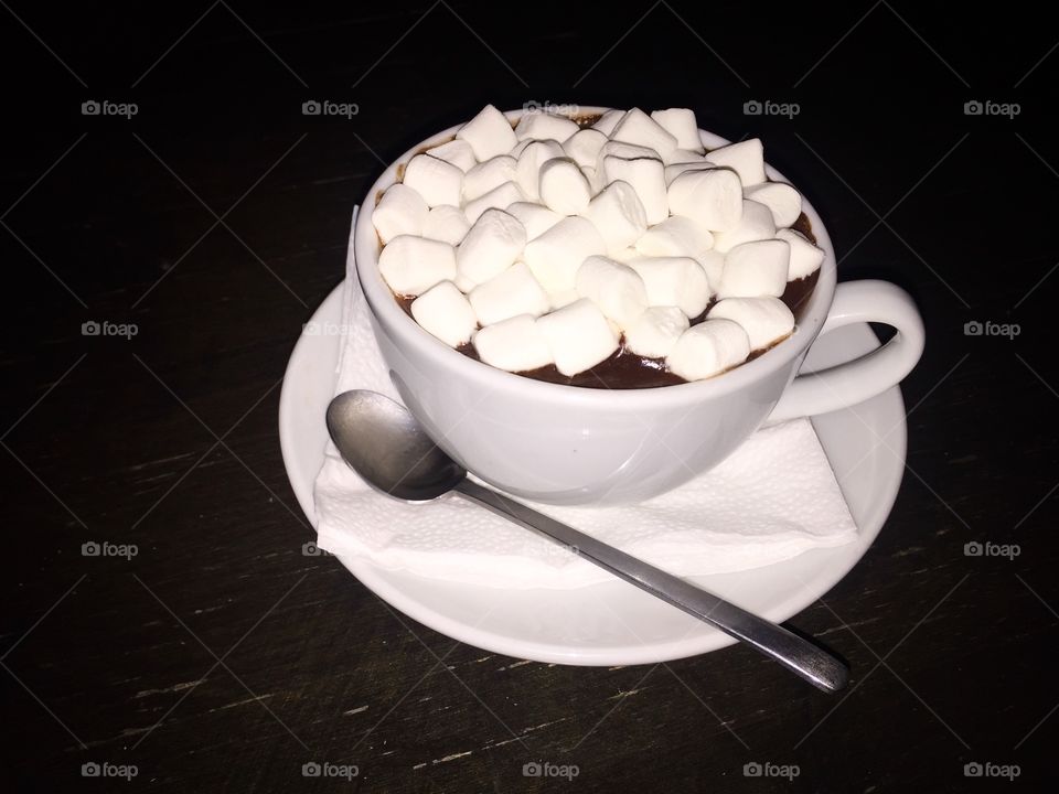 White cup of hot chocolate with marshmallows