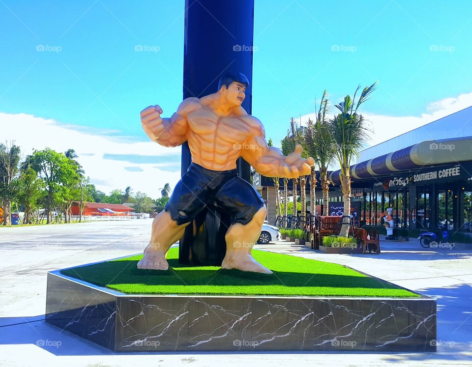 RATCHABURIE THAILAND 2019- The statue look alike Hulk cartoon model standing in front of fitness gym.