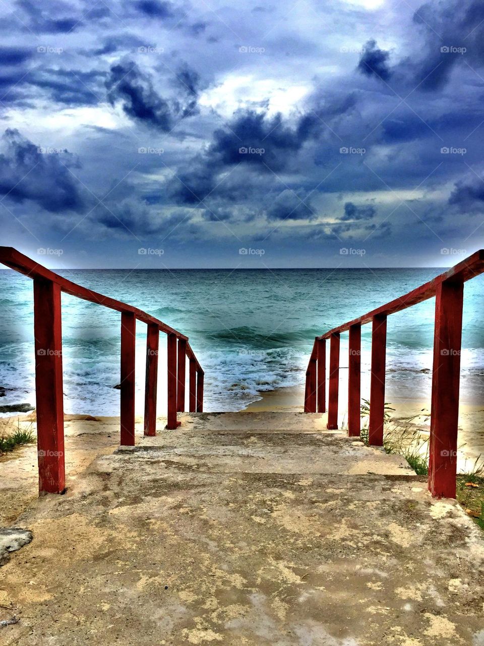 Stairway leading to the beach, red staircase to the beach, watching waves, oceans of the Caribbean, picture perfect beach day