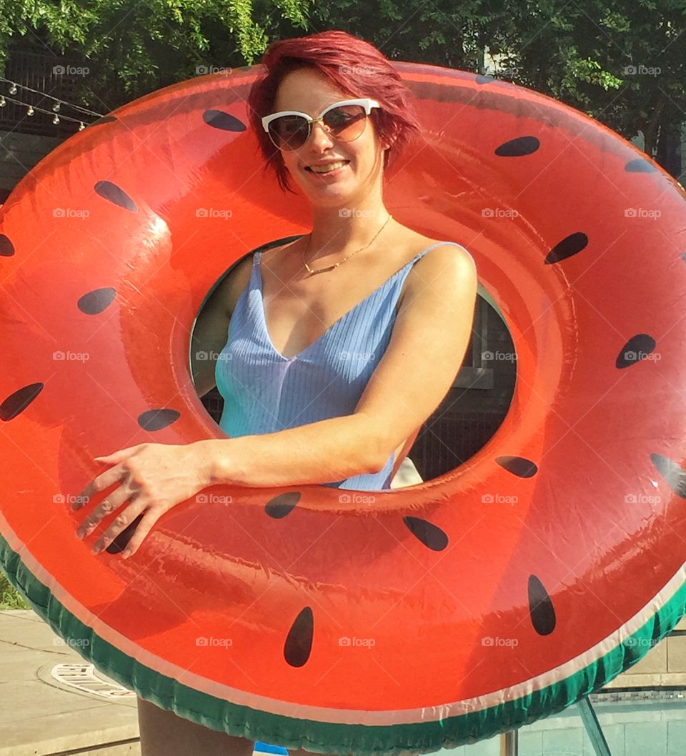 I took this photo of my girlfriend while we were by the pool at my apartment complex. The sun was great and she came marching up with this watermelon floaty and it was perfect!