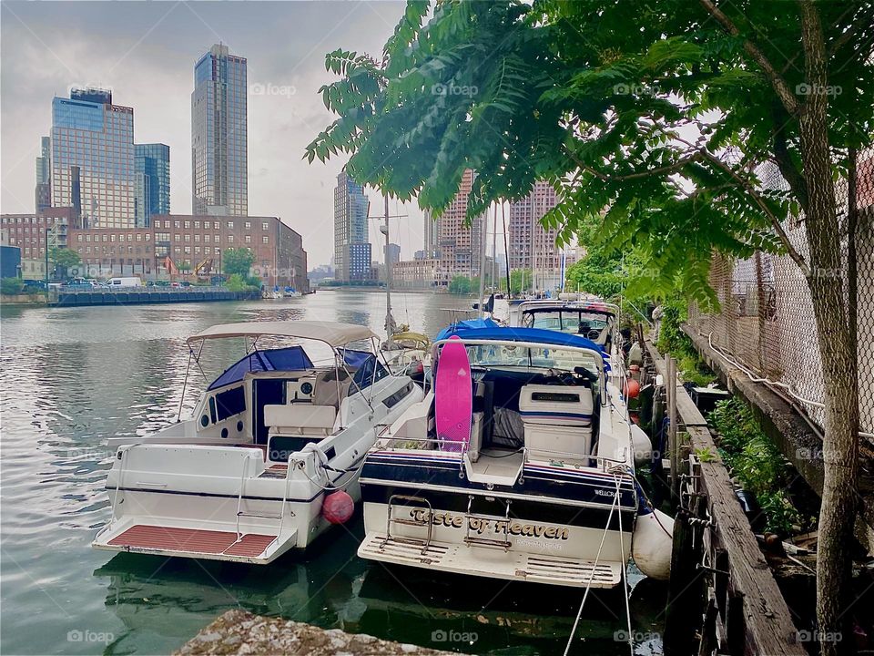 These boats are tied to the “Long Island City” shore here at “Newtown Creek” by the “Pulaski Bridge” and lend an idyllic atmosphere to the area. 2023. Hypnotic Productions