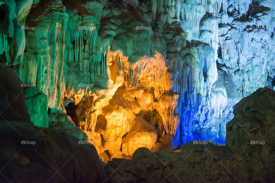 Blue, green and orange light in a cave