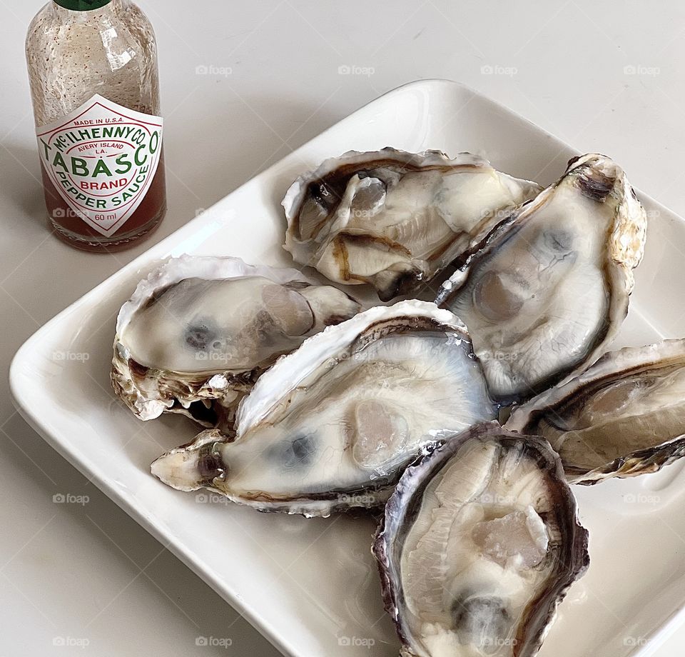Half a dozen Freshly shucked Japanese oysters with tobacco sauce 