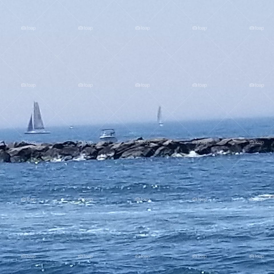 sail boats and boat in the harbor