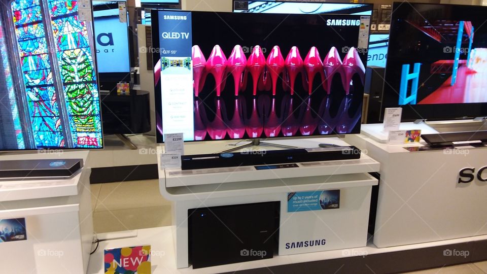 Samsung QLED television 4K Ultra High Definition TV with soundbar and sub-woofer