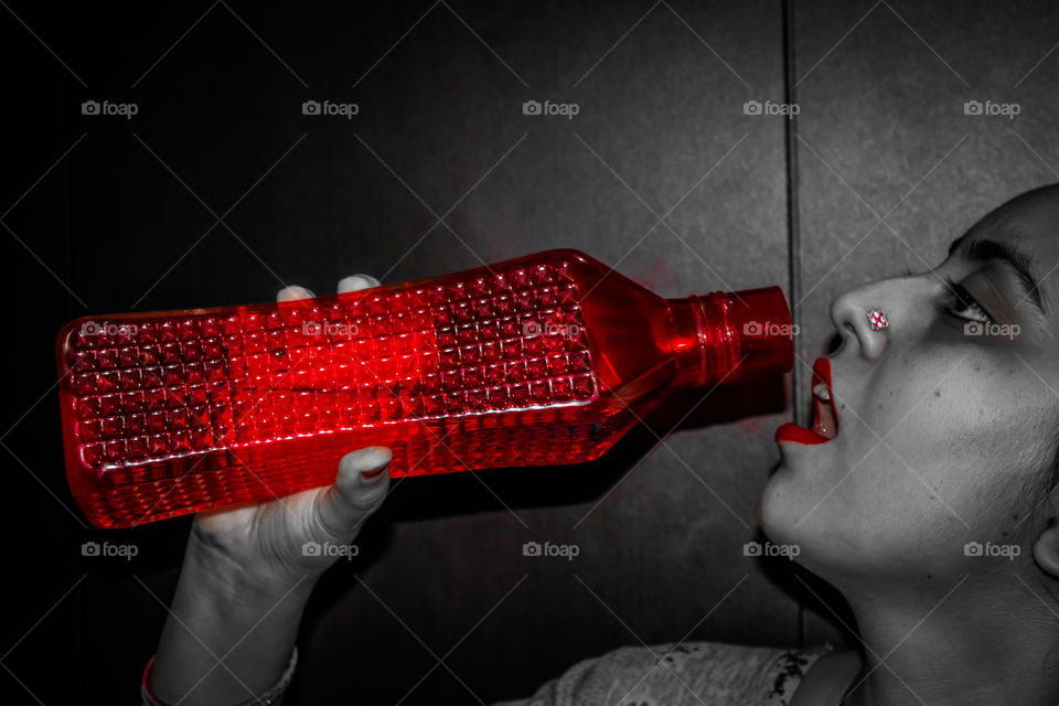 Red highlight with red bottle and the lipstick