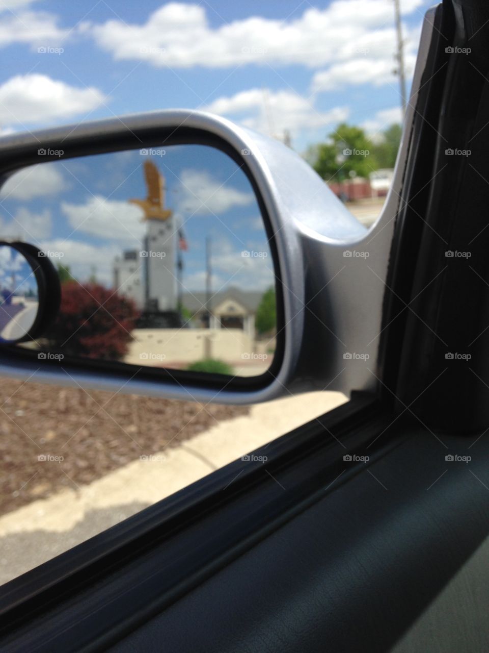 Downtown Fishers in the side mirror