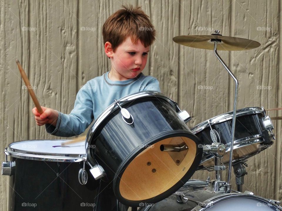 Child Rocking Out On Drums