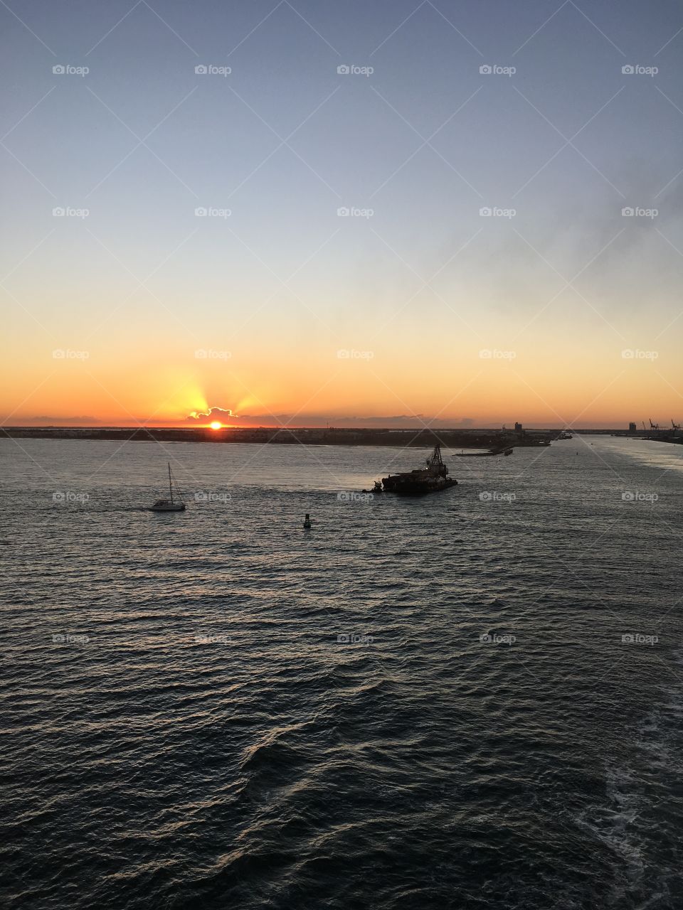 Sunset off the Port Canaveral shore 