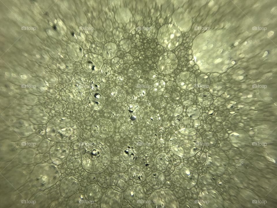 Green color water bubbles in camera lens with light