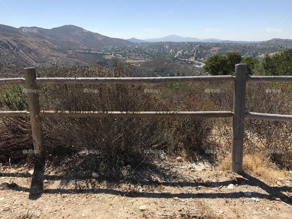 Wooden fence in the desert mountains on a hiking trail in San Diego, California. 