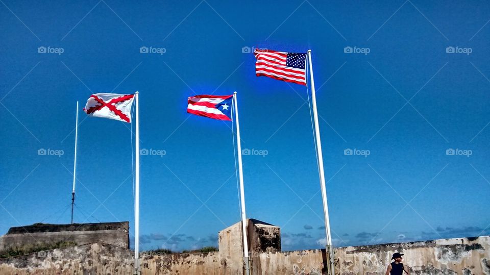 The Spanish Colonial, Puerto Rican, & American Flag at El Morro. At El Morro in San Juan, Puerto Rico, the three flags represent the new and existing history of Puerto Rico.  