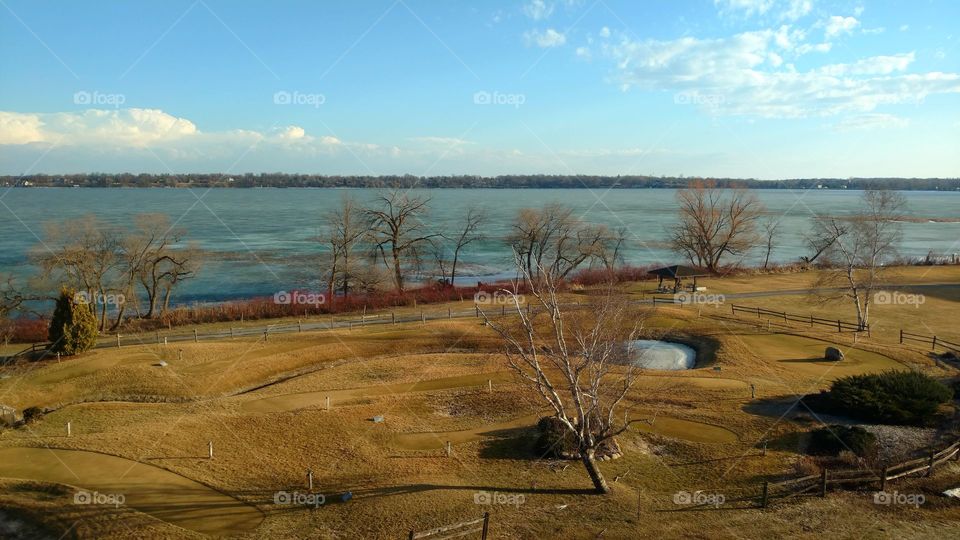 overlooking trees and Golf Course frozen lake Minnesota