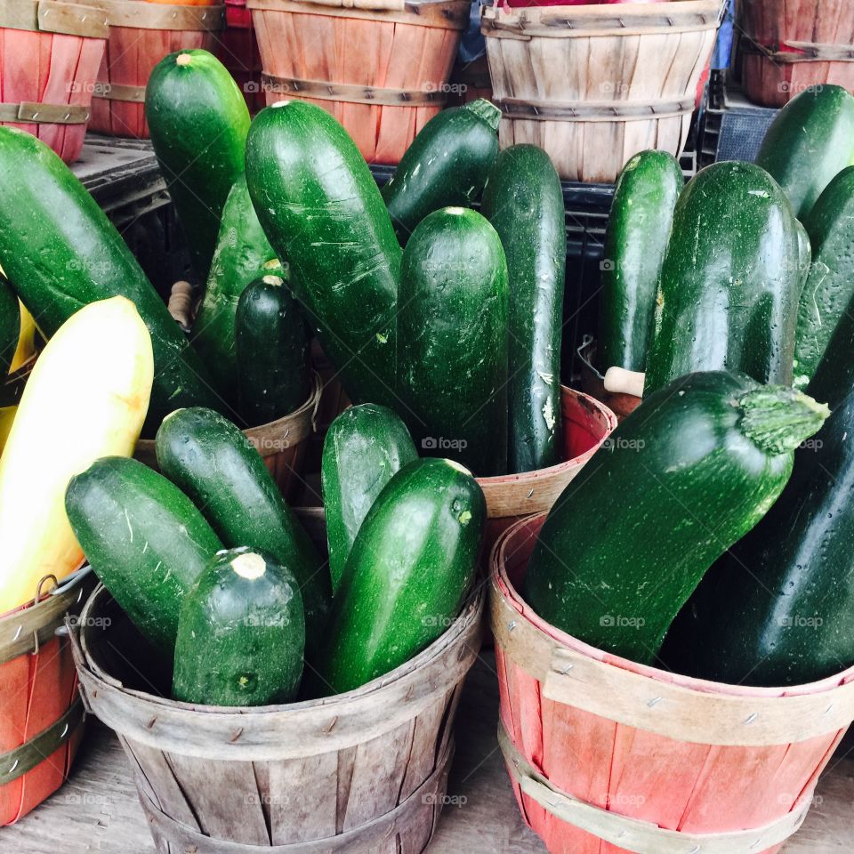 Big green cucumbers in baskets at he farmers market in Texas 