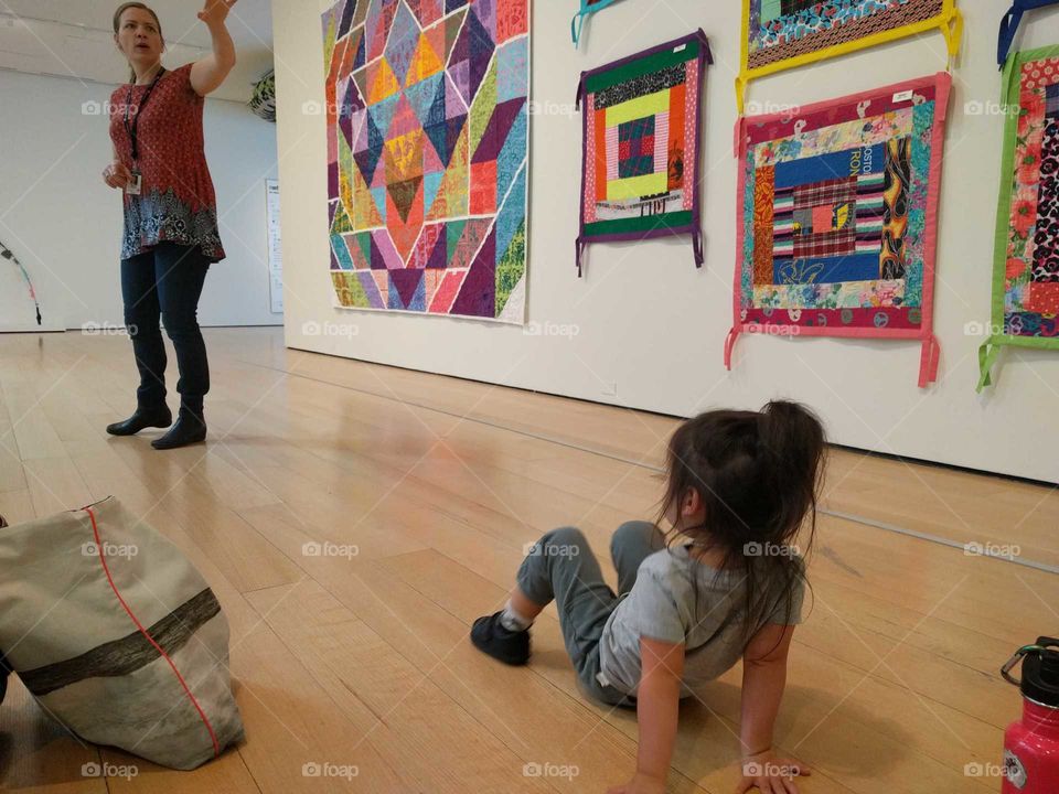 A small child learned about quilting at the MFA Boston.