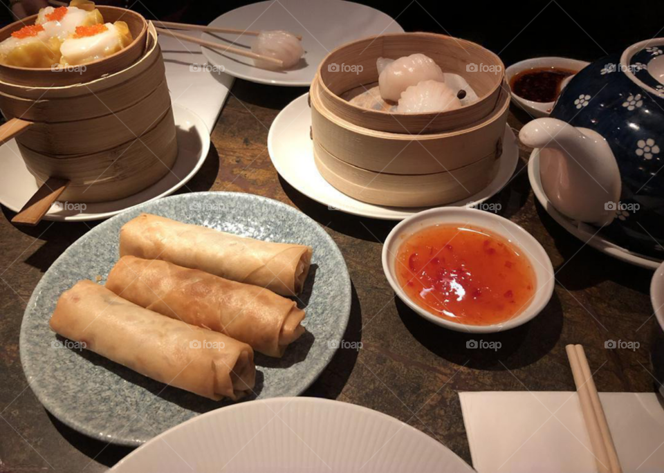 Chinese assorted dim sum dinner including spring rolls, buns and dumplings, steamer basket, Asian cuisine, Cantonese cuisine, Chinese cuisine