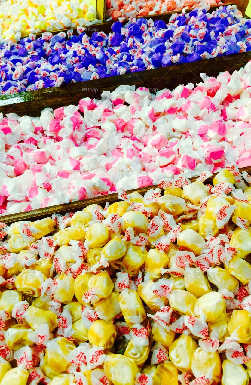 Tell Me Taffy. Several bins of taffy candy