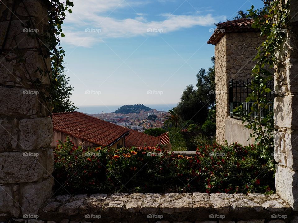 View of city of Nice from the stone pergola in the monastery gardens in Cimiez, France.