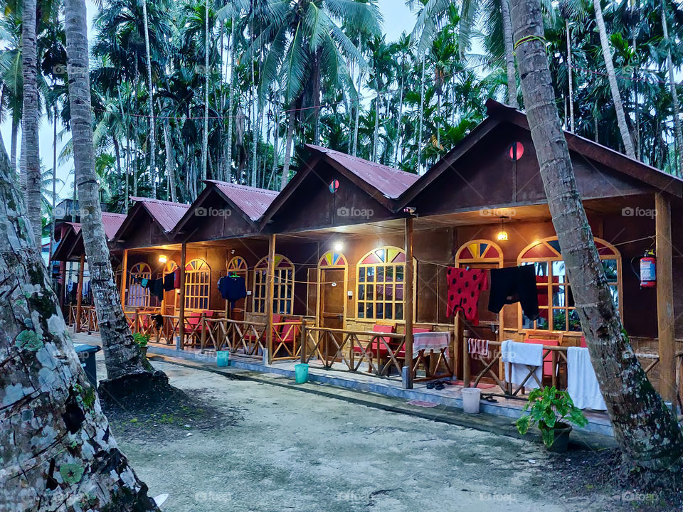 A photo of hut house located near the beach