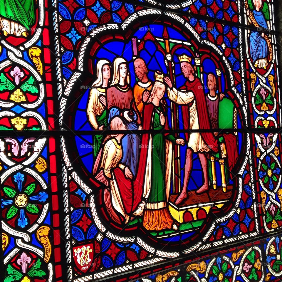 Stained glass window depicting the biblical story of the crowning of Esther, taken at Ely Cathedral in Cambridgeshire.