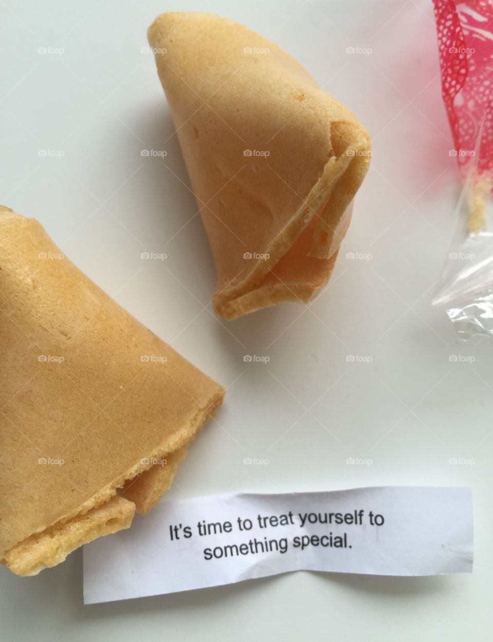 Fortune cookie. Time to treat yourself to something special. Fortune cookie message. 