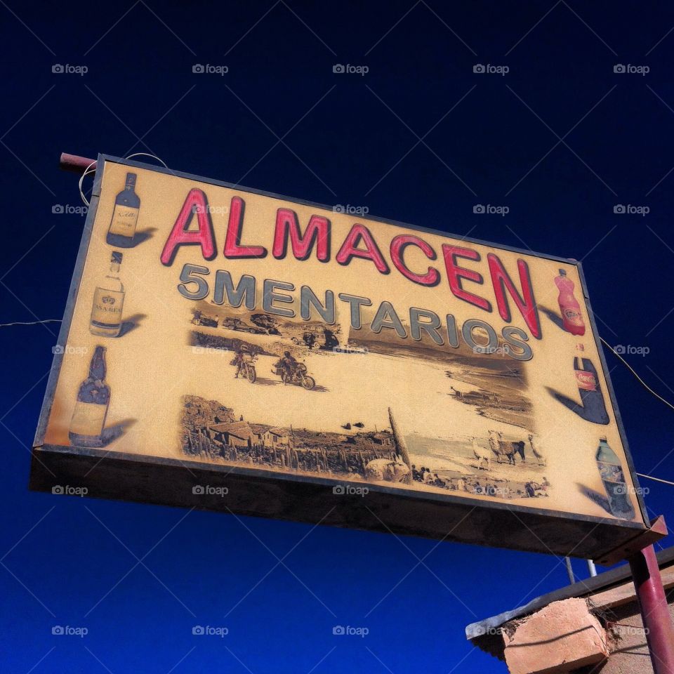 Shop sign . A sign on the road, across the Uyuni Salar desert. 