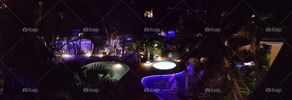 Panorama night shot of the pool area at the Worthington Resort Fort Lauderdale Florida.