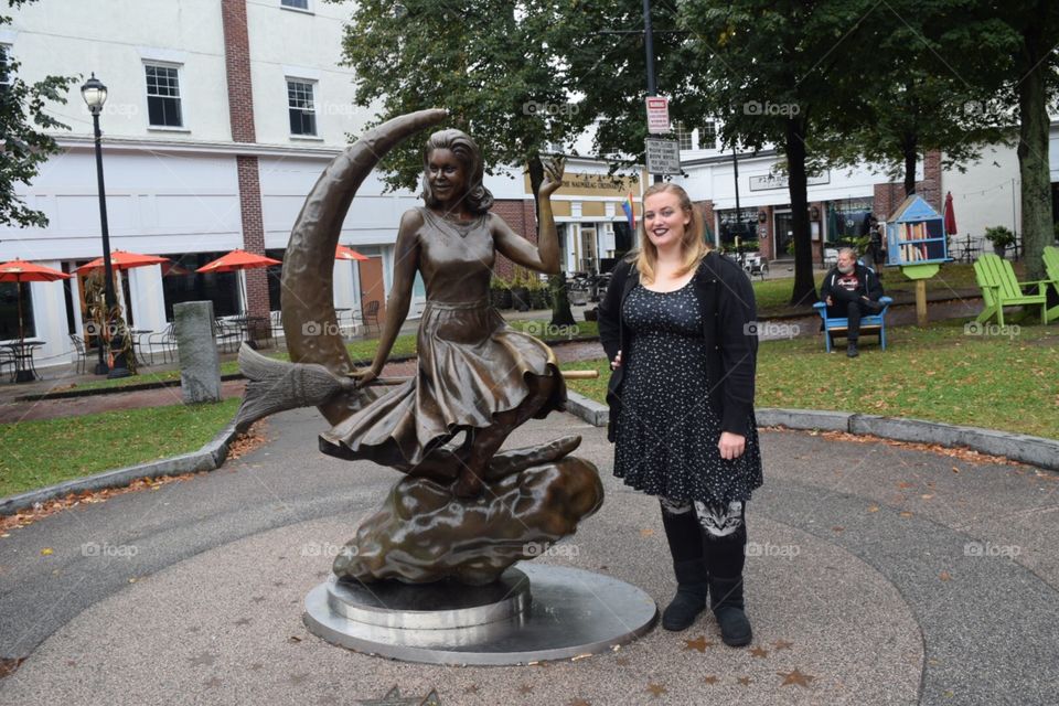 Standing with the bewitched statue in Salem Massachusetts 