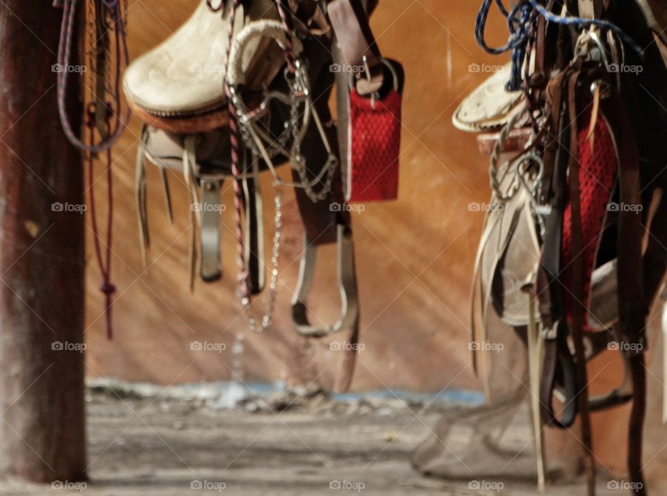 Saddles Hanging In A Stable. Horse Saddles Hanging In Stables Of A Mexican Ranchería
