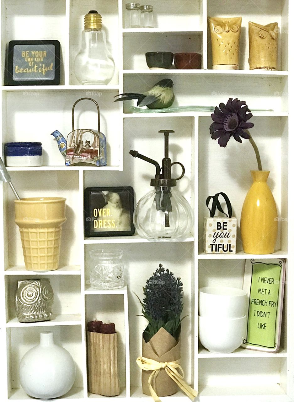 A white shelf full of a collection of fun treasures!