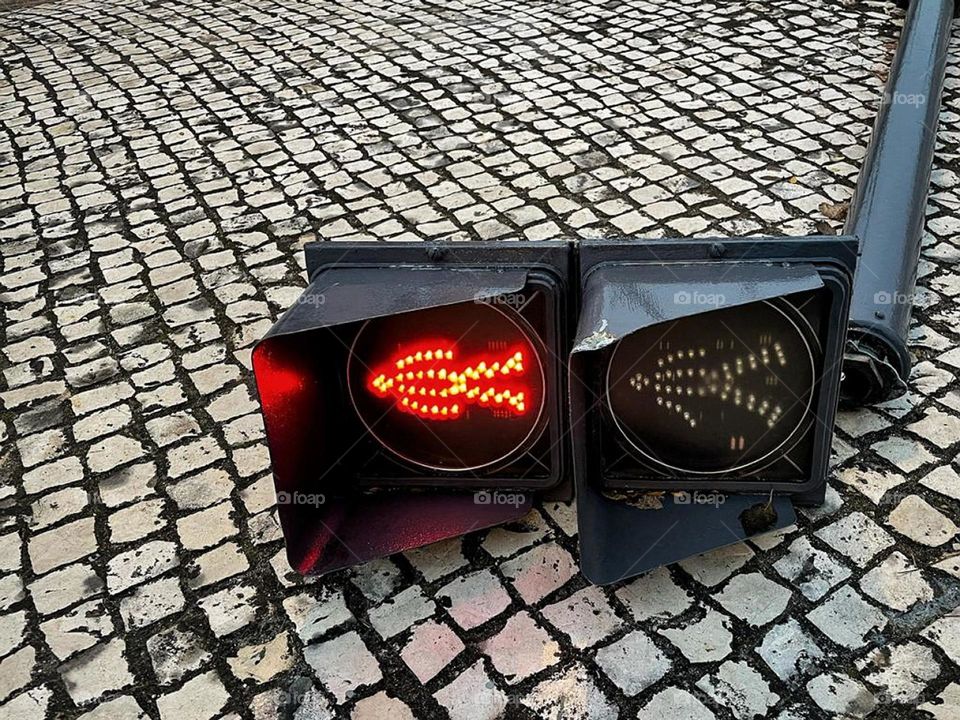 Street sign on the floor.