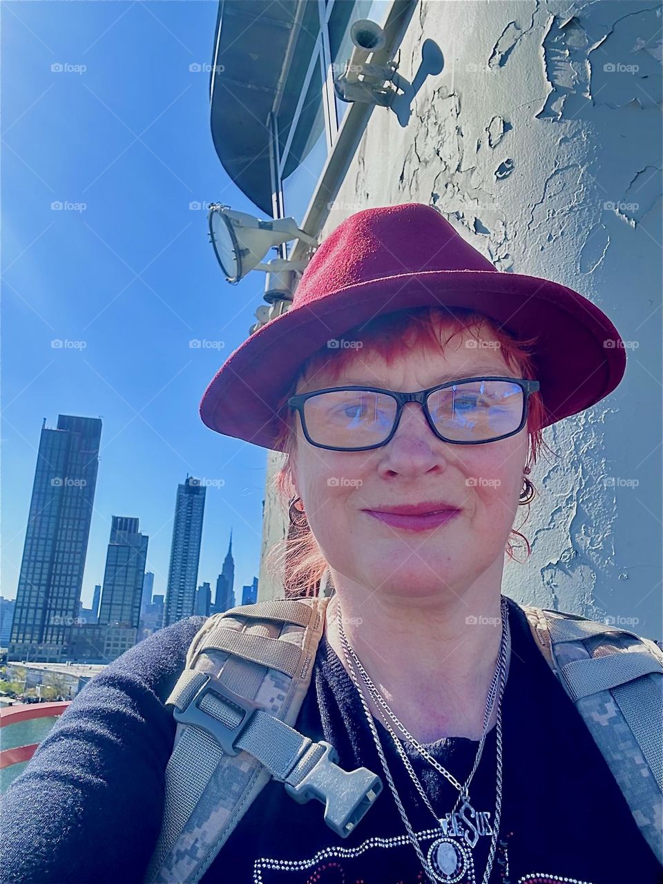 This is me, “Petra Schiller” a.k.a. “Maxine Firefox” a.k.a. “Maximiliane Feuerfuchs” standing by the center outpost of the “Pulaski Bridge” at “Newtown Creek” that connects “Greenpoint”, Bklyn to LIC on a sunny day in April 2024. Hypnotic Productions