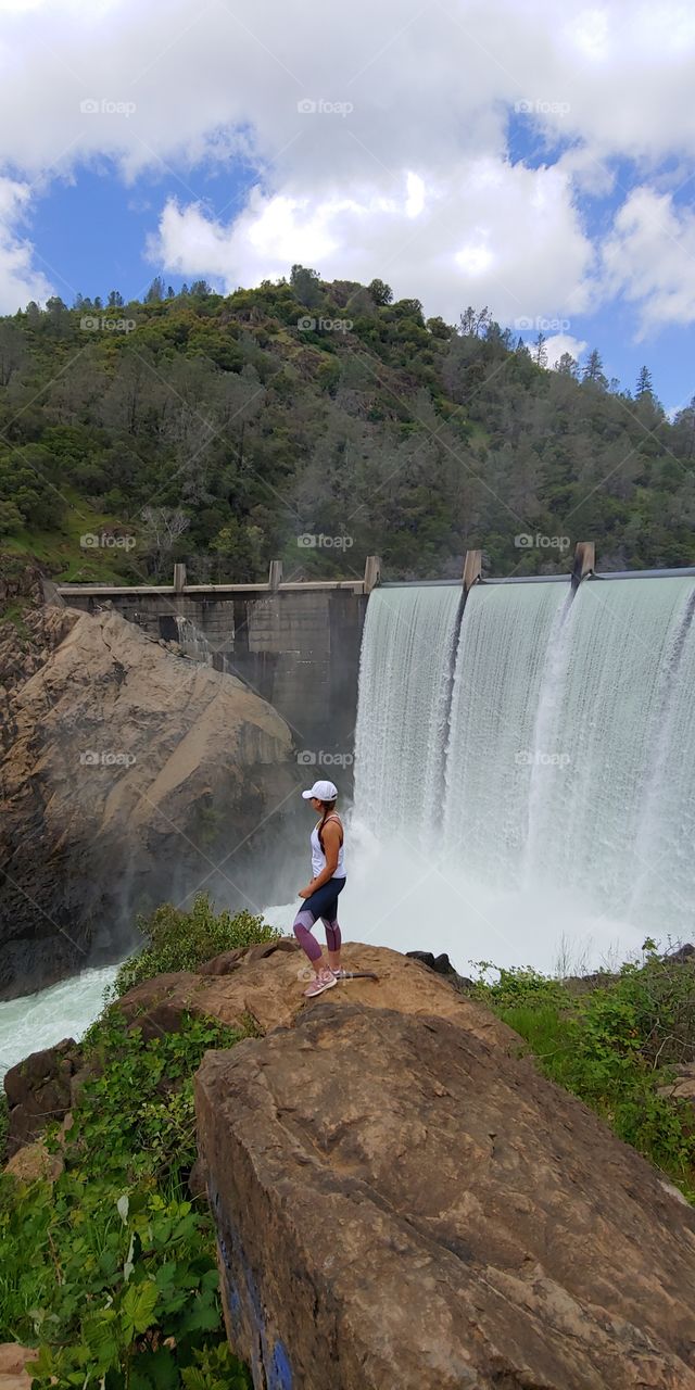 Breathtaking view of a gorgeous waterfall pool dam on Clementine trail. A must see hiking experience with family and friends on top of a mountain cliff on a Sunny day.
