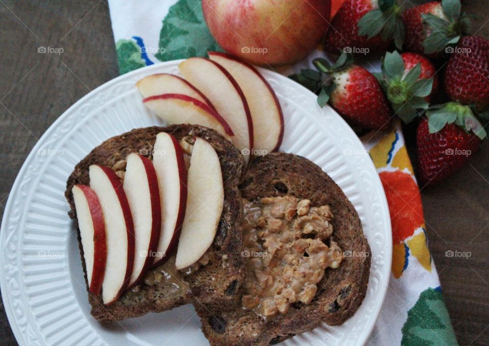 Peanut butter raisin toast and apple slices