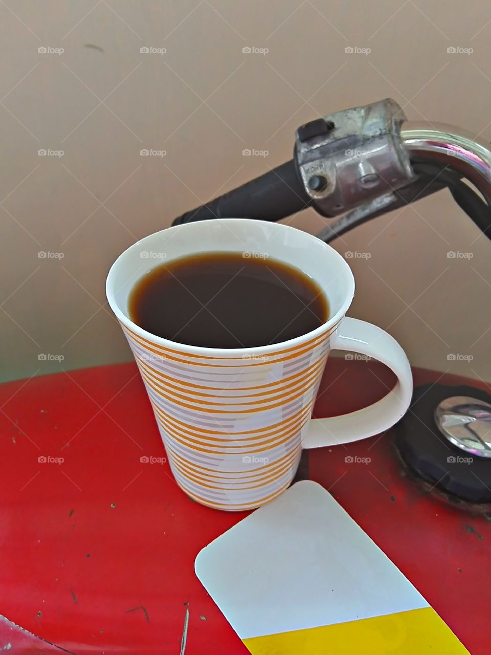 Morning black coffee first before riding the motorbike..