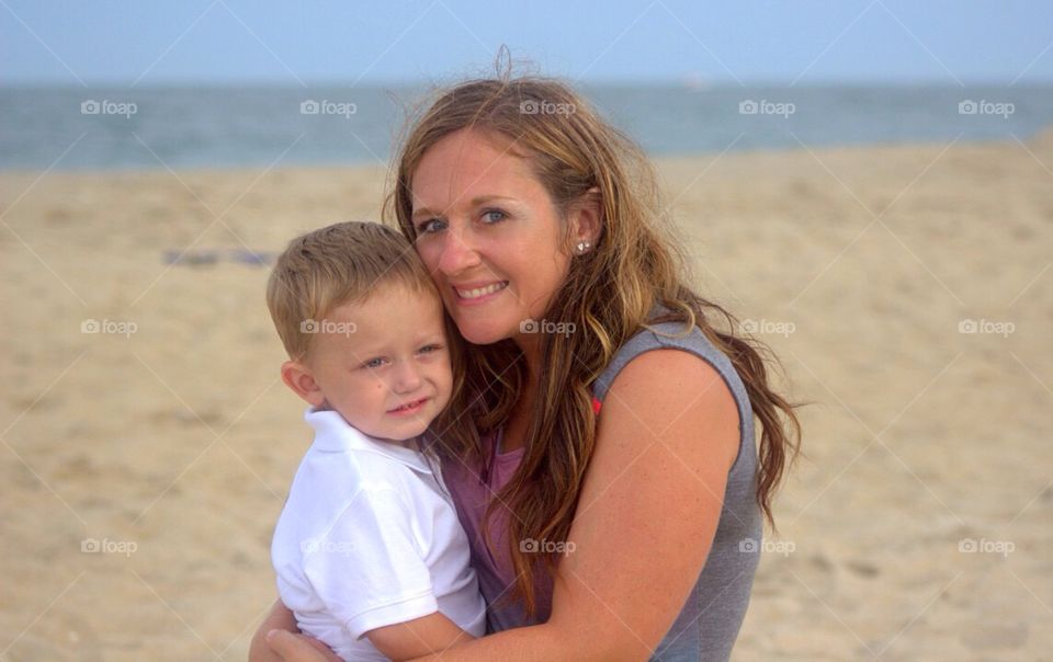 Smiling mother and son at beach