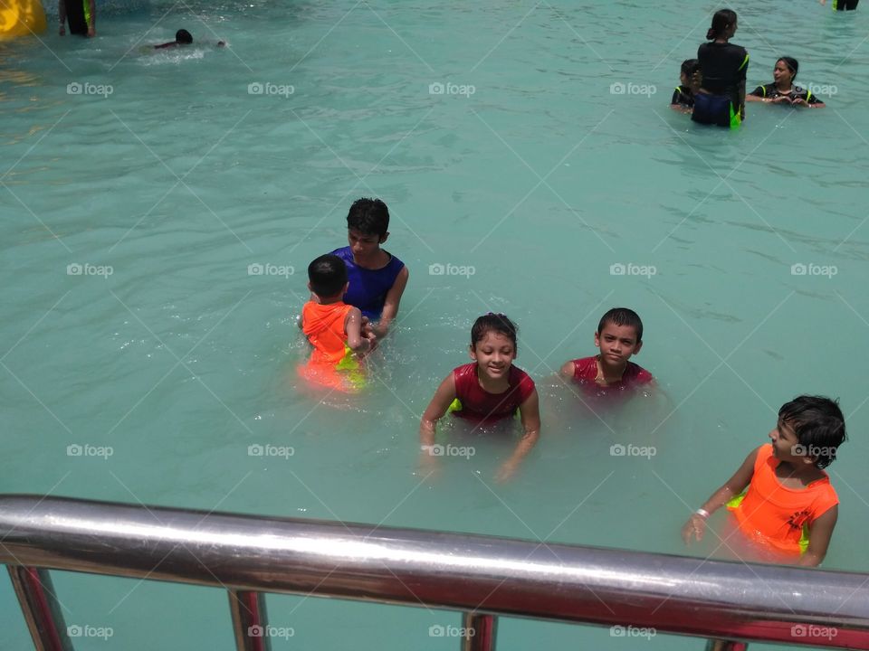 Kids into water pool