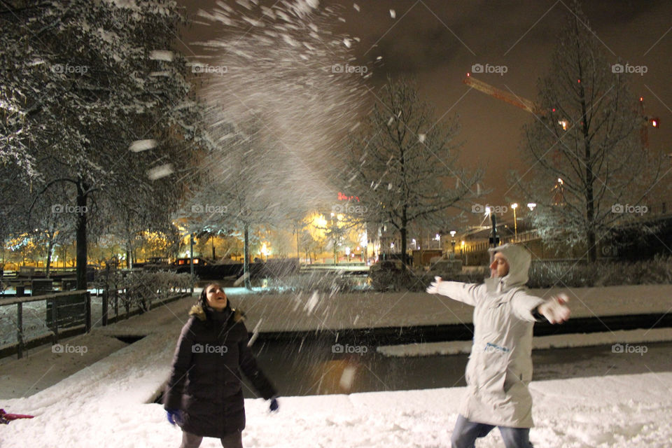 Boy and girl playing in the snow