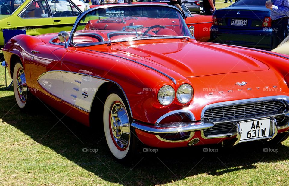 My little red corvette. Red corvette with white inserts dual lights and whitewall tires