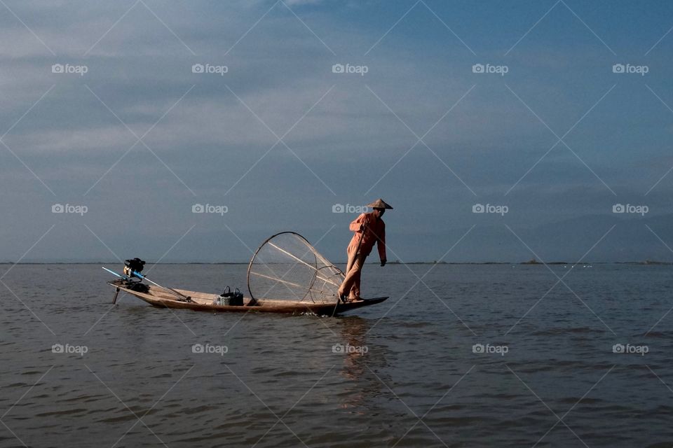 Rowing a boat with his legs