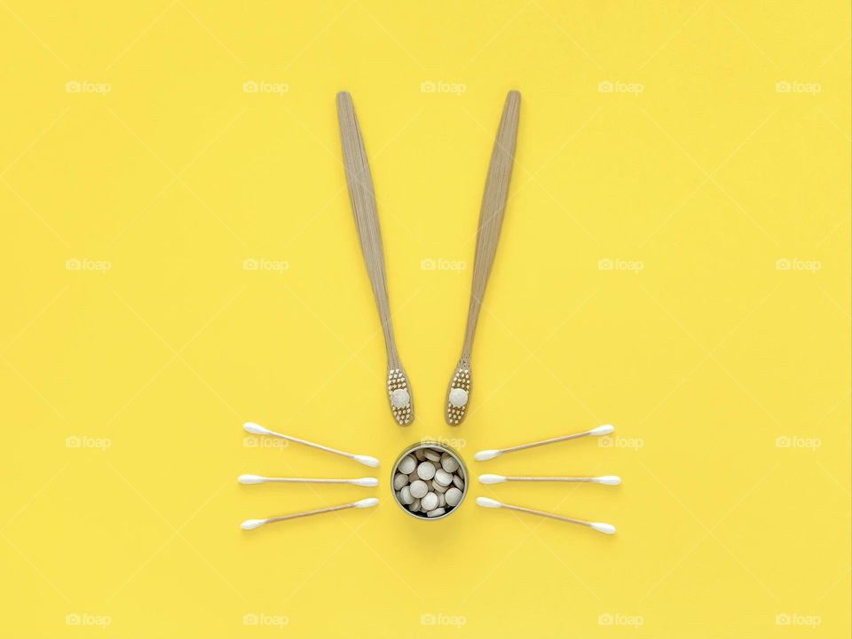 Eco rabbit on yellow: bamboo toothbrushes, toothpaste, hygiene care