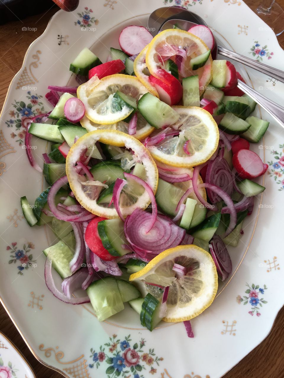Fresh salad with lemon slices