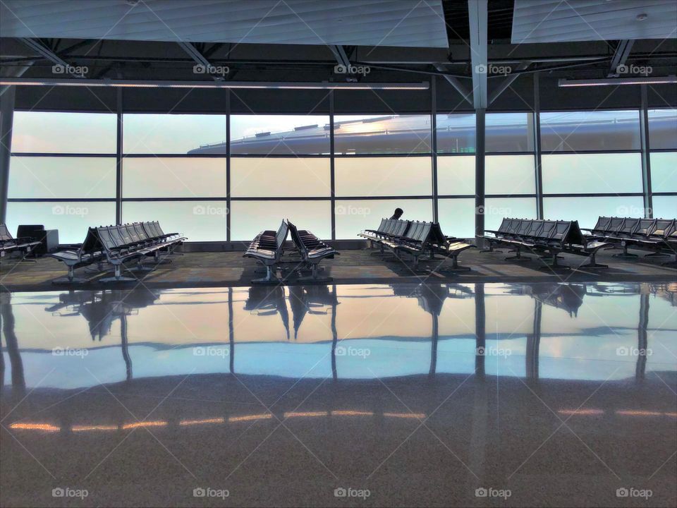 Lone traveler reflecting on a relaxed ambiance for travel experience - Airport Adventure by Foap Missions