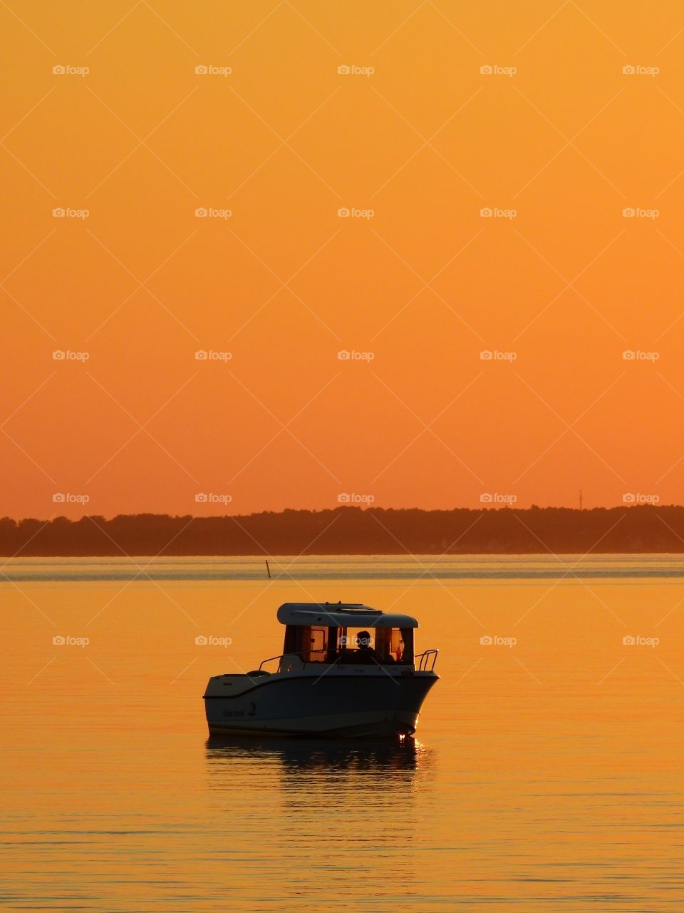 The sky is orange - reflecting in the sea