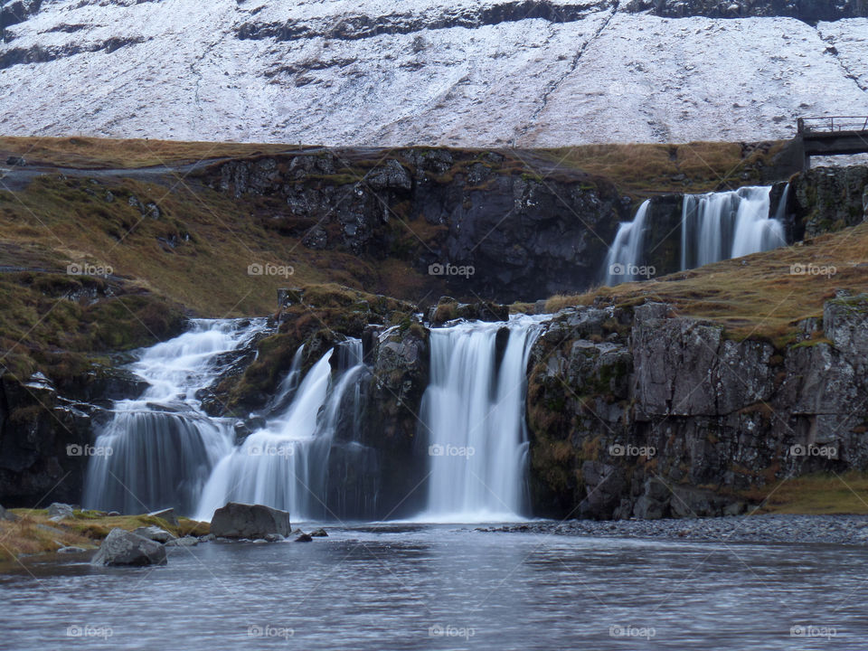 The scenic Kirkjufellsfoss Waterfall in Iceland