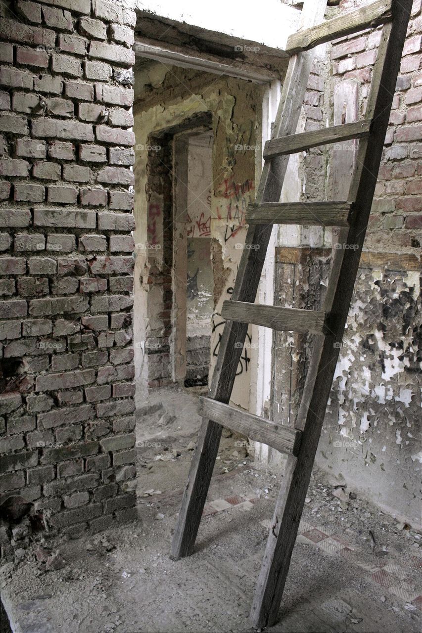 portrait of a wooden staircase in an abandoned room