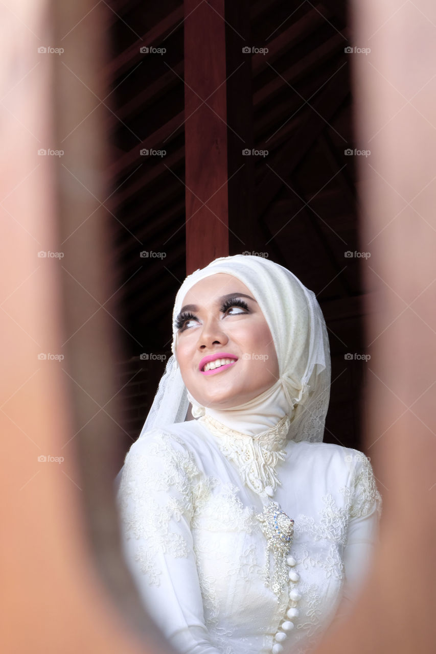 Thoughtful smiling bride