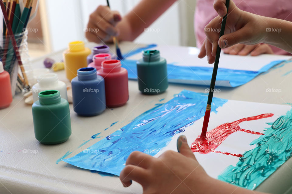 Children creating paintings