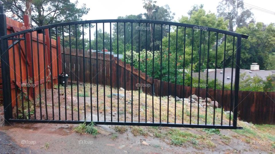 upscale wrought iron driveway swinging gate